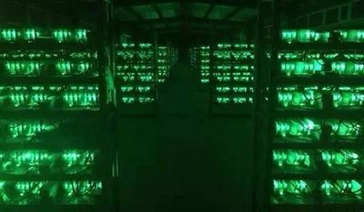 A sprawling Bitcoin mining farm with rows of rigs